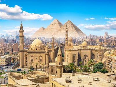 View of the Mosque Sultan Hassan in Cairo and pyramids